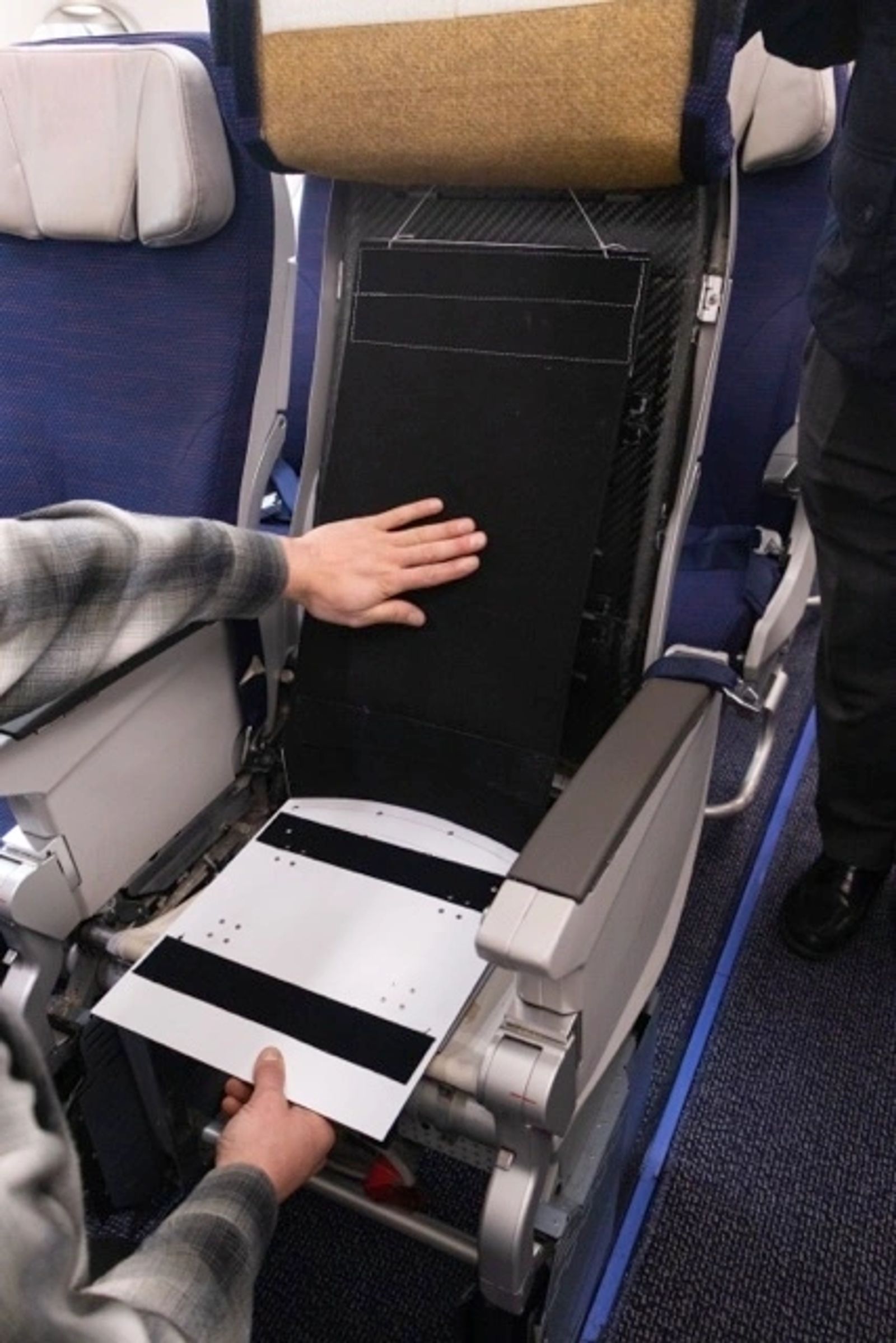 Kit being installed on a seat